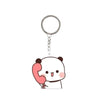 A white cartoon panda face charm with pink ears and a red phone receiver attached to a silver keyring.