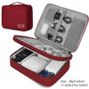 A red portable digital organizer storage pouch with an open lid showing various electronic accessories and storage compartmen