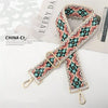 A patterned fabric strap featuring geometric designs in teal, pink, and beige, shown against a light background.