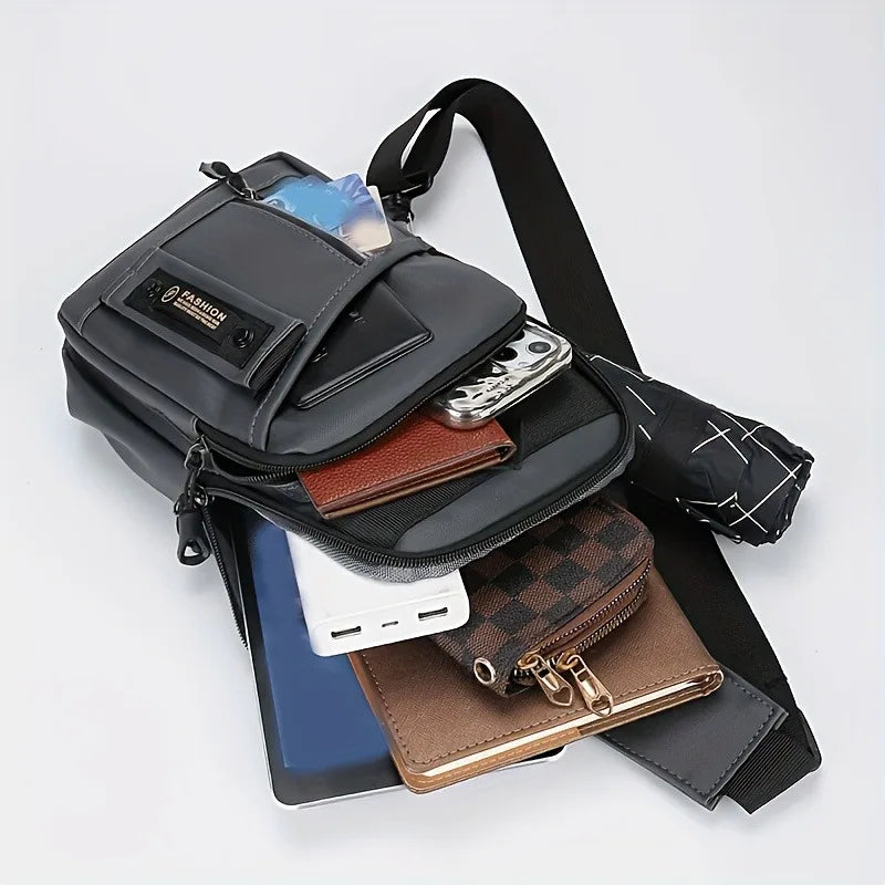 A black nylon crossbody sling bag with multiple compartments and a leather card holder is shown against a white background.