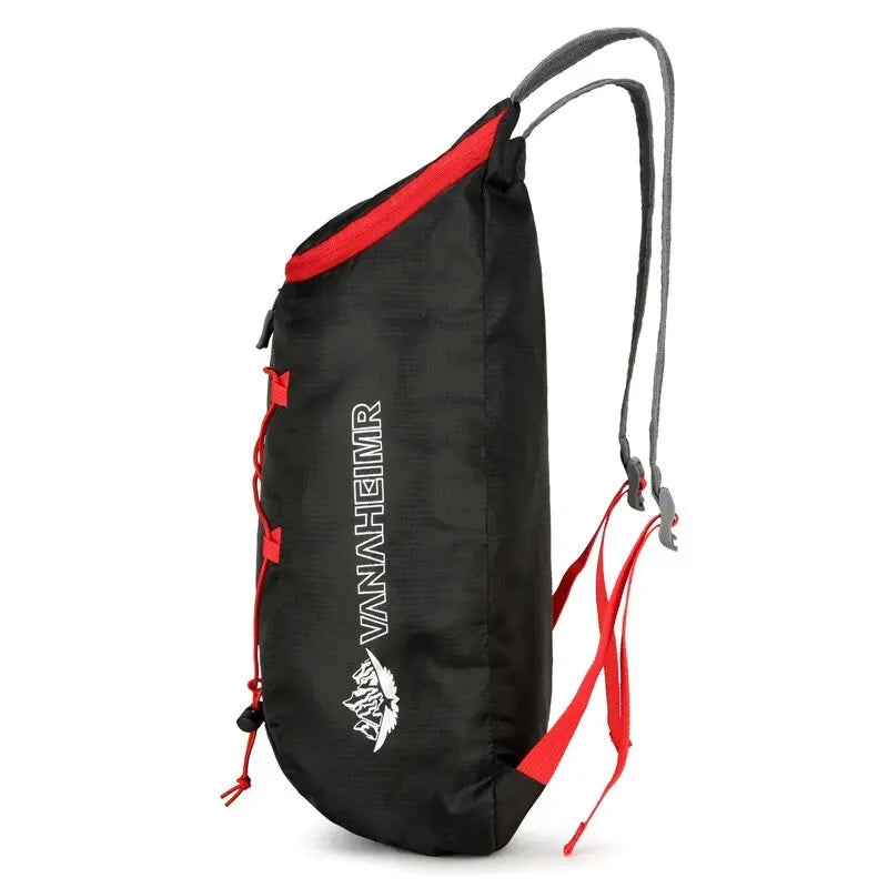 Black outdoor folding backpack with red trim and a leather emblem