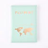 A light mint green passport holder wallet with gold foil printing of a world map and the word PASSPORT.