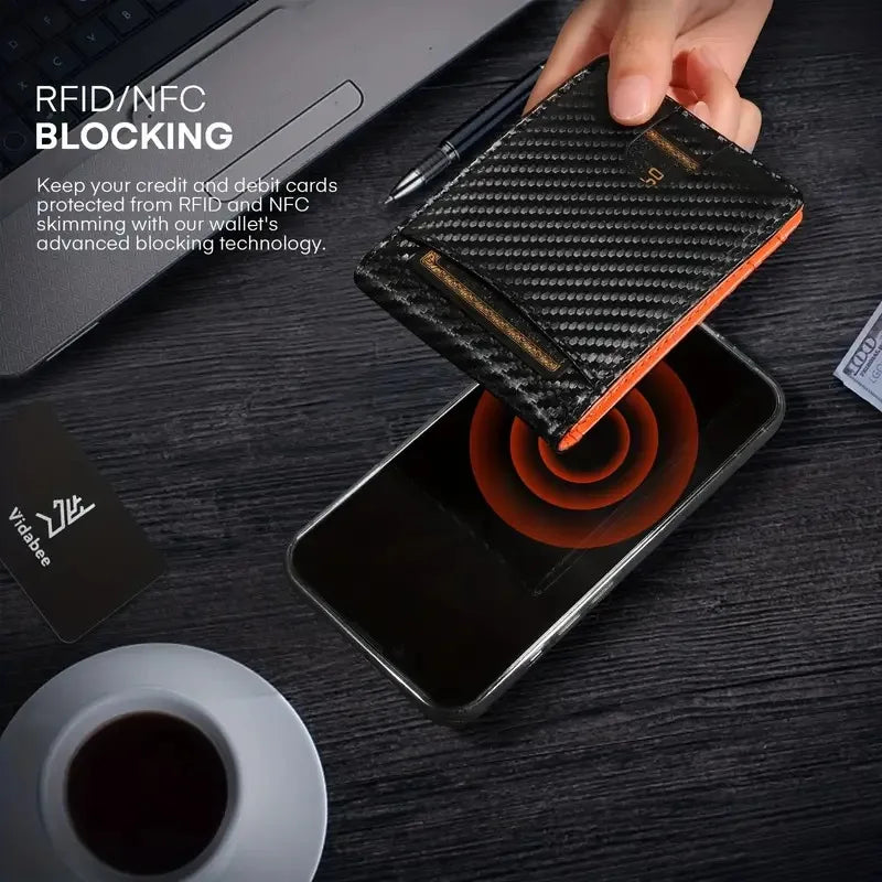 A hand holds a black slim bifold wallet with RFID blocking technology over a smartphone.