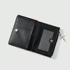 Black leather wallet with a red accent and a zipper coin pocket.