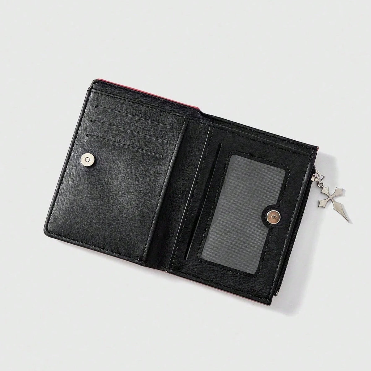 Black leather wallet with a red accent and a zipper coin pocket.