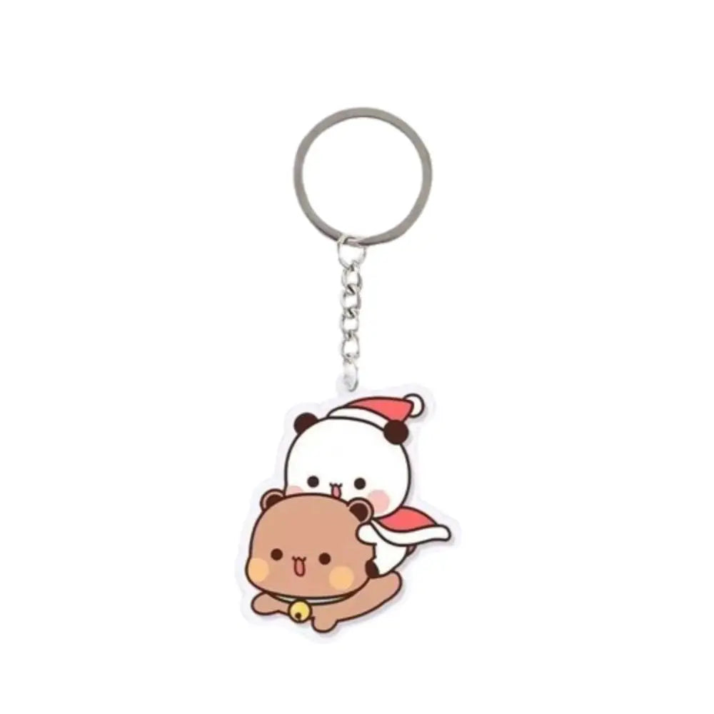 A cute cartoon resin keychain charm featuring a white and brown bear character.