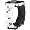 Una correa de silicona blanca con diseños florales negros mostrada en un reloj inteligente.