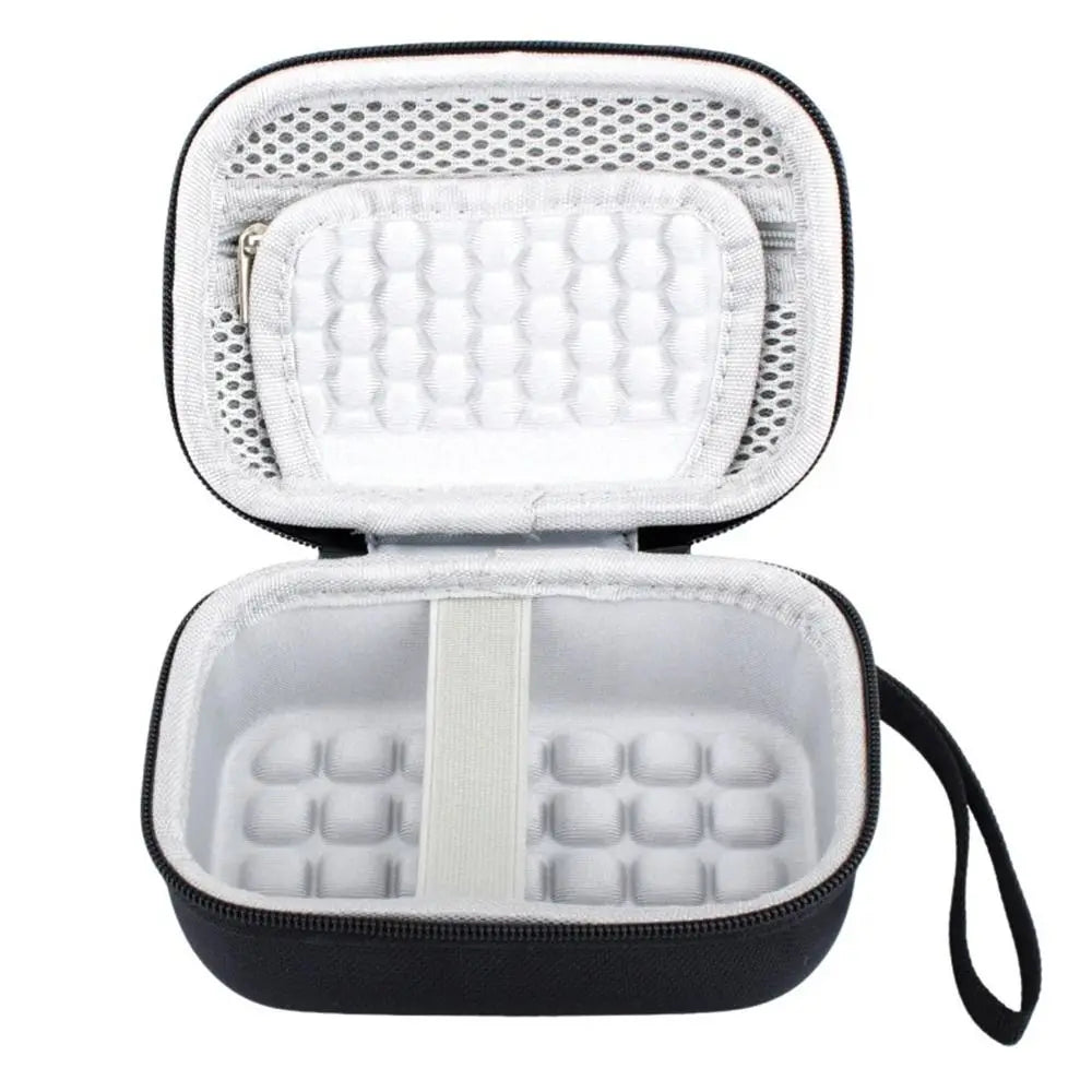 A black hard shell case with a white interior foam insert for protecting digital cameras.