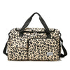A beige leopard print travel duffel bag with black straps and a separate shoe compartment.