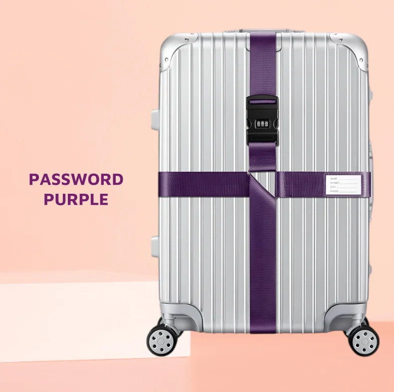 Silver rolling suitcase with purple cross straps and a black lock.