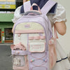A woman is wearing a light purple and cream Candy Color Campus backpack with white trim and pink accents.