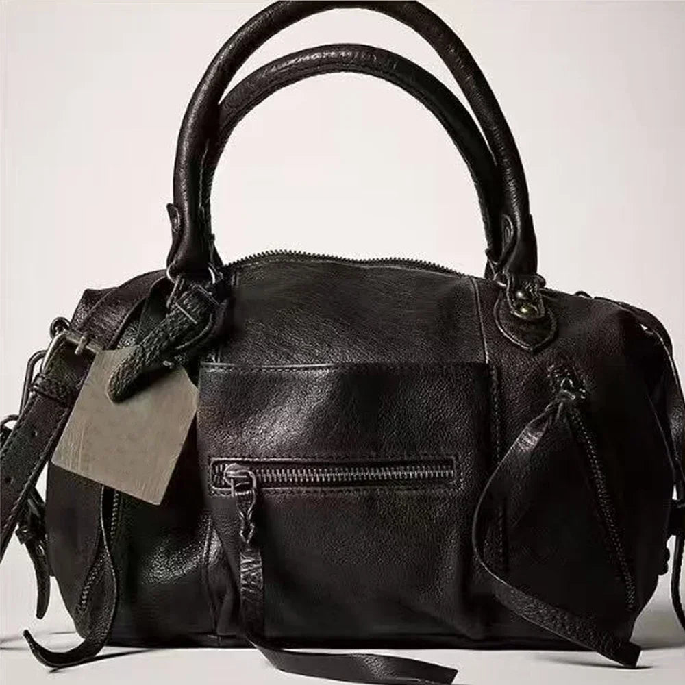 Black vintage PU leather crossbody tote bag with adjustable strap shown from the front.