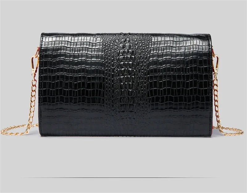 Black alligator pattern leather clutch bag with gold chain strap