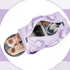 Diagram showing the features of a purple waterproof travel duffel bag, including front pocket, side mesh pockets, interior zi