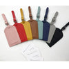 A set of ten PU leather luggage tags in various pastel and earth tones displayed against a white background.