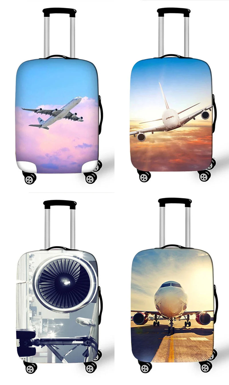 A collection of four luggage bags, including a blue and pink suitcase, a light blue suitcase, a clear acrylic suitcase, and a