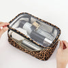 A leopard print cosmetic bag with a clear lid is shown open, containing various skincare products.