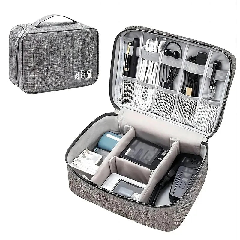 A gray leather cable storage organizer bag with an open lid showing various electronic cables and accessories.