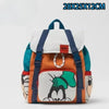 Mochila de pato-ratón de peluche en colores naranja, blanco y turquesa.