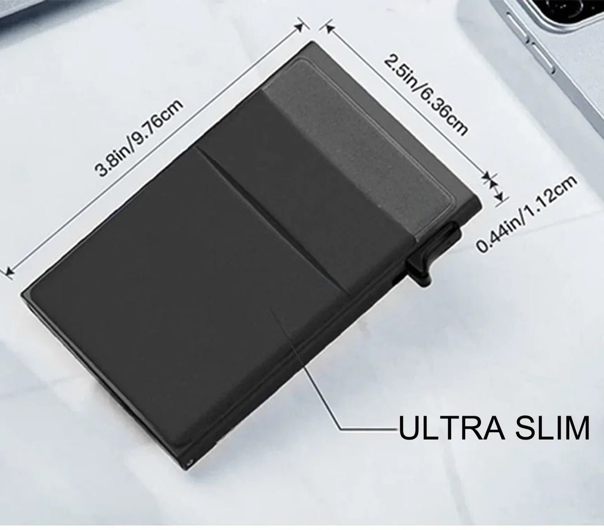 A black ultra slim metal pop-up card holder wallet shown on a white surface.