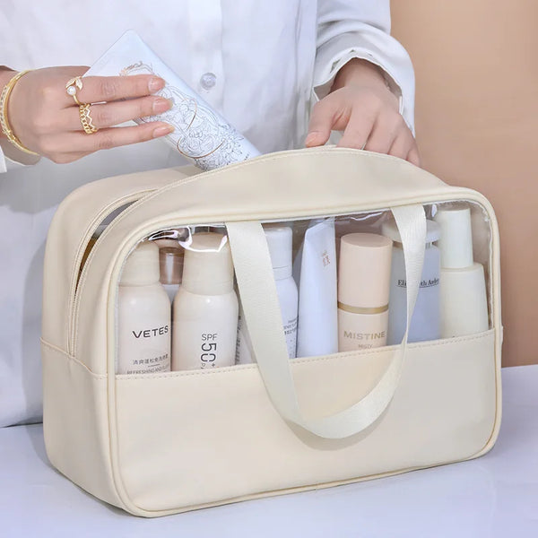 A beige cosmetic and bath storage bag is shown with several white bottles inside, held by a person.