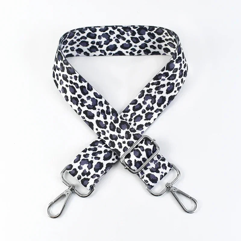 A black and white leopard print adjustable crossbody strap for bags.