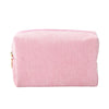 A pink corduroy makeup organizer bag with an octagonal design.