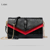 Black and red alligator pattern leather clutch bag with gold chain strap