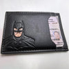 A black leather card holder featuring a Batman logo and an attached identification card.