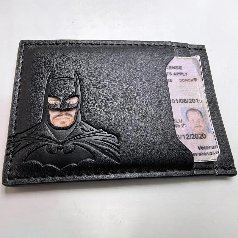 A black leather card holder featuring a Batman logo and an attached identification card.
