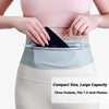 A pink slim waterproof running waist pack is shown being worn around the abdomen of a person.