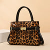 A brown and black leopard print PU leather shoulder handbag with a black leather handle and gold hardware.