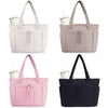 A set of quilted padded tote bags in white, beige, pink, and navy colors.