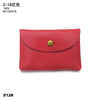 A red genuine leather card holder or coin purse with a gold-colored clasp.