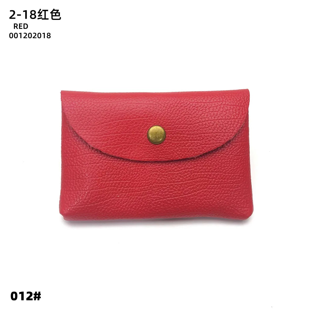 A red genuine leather card holder or coin purse with a gold-colored clasp.