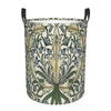 A vintage floral laundry hamper with a patterned fabric and black handles.