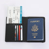A black passport organizer featuring slots for various cards and a blue passport.