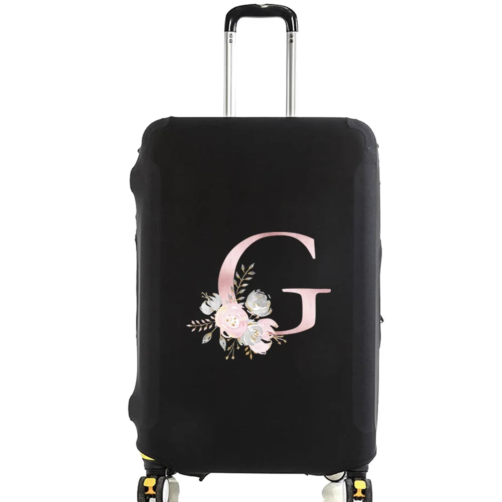 Black luggage with a pink floral monogram design on the side