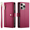 A magenta leather crossbody phone case for an iPhone, shown with a zipper and attached to a keyring.