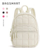 A cream-colored quilted laptop backpack with light beige trim and zipper details.