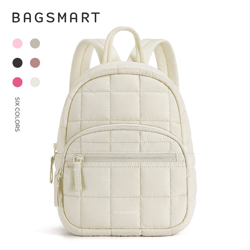 A cream-colored quilted laptop backpack with light beige trim and zipper details.