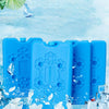 Blue reusable ice pack with snowflake designs surrounded by crushed ice.