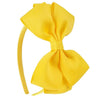 A bright yellow fabric bow headband is shown against a white background.