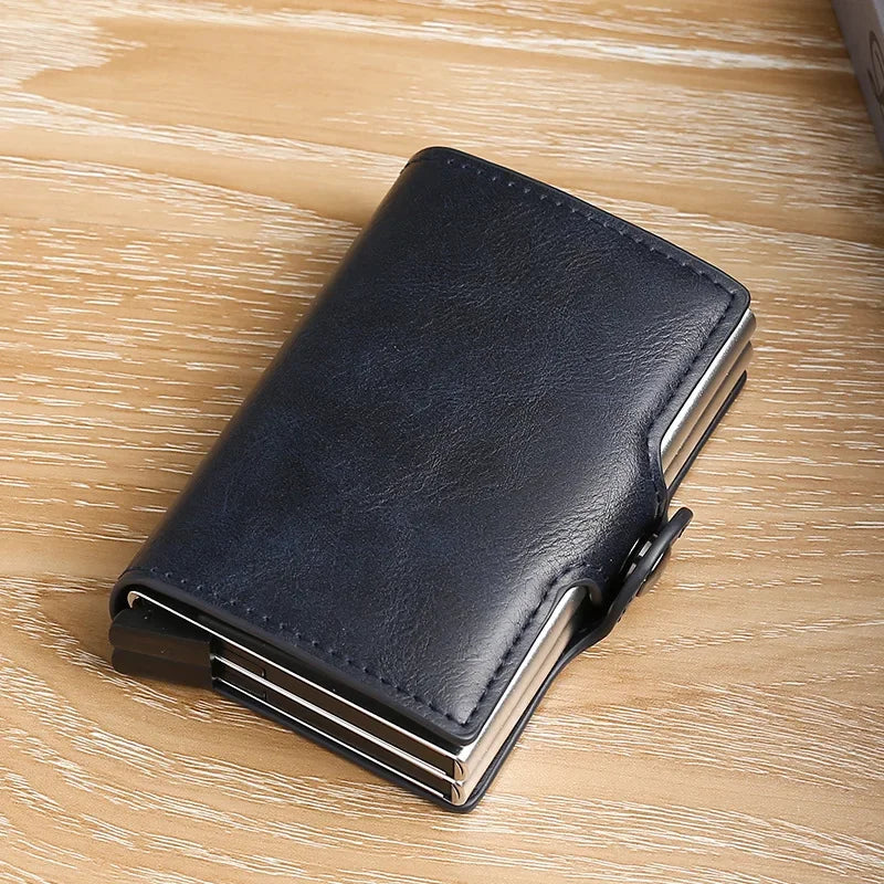 A black premium double layer ID card holder wallet resting on a light wooden surface.