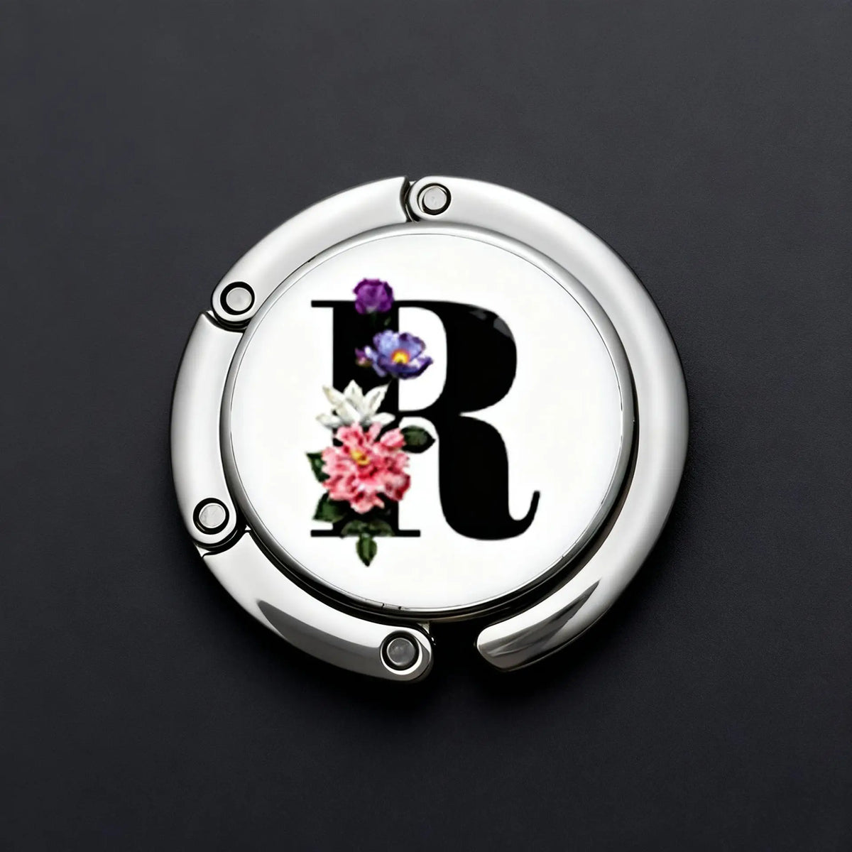 Silver foldable letter hanger hook with a large black initial R and floral accents