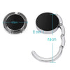 A silver bag hook with a round, black magnetic closure and a curved metal loop.