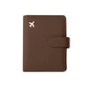 A brown leather passport organizer with a logo embossed on the cover.