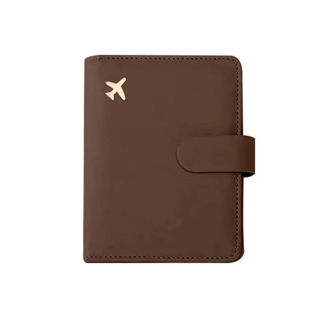 A brown leather passport organizer with a logo embossed on the cover.