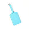 A light blue custom PU leather luggage tag with a silver clip attached.