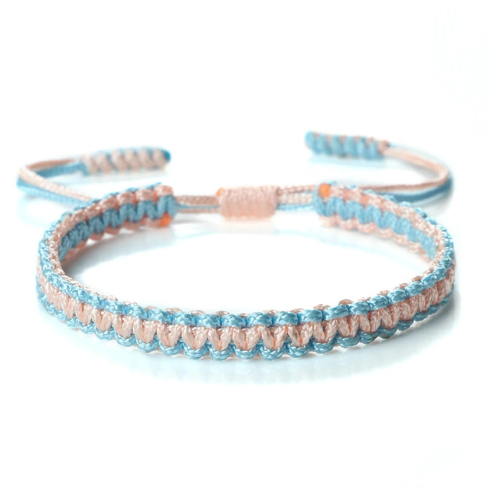 Handmade braided rope bracelet with light blue and peach threads, adjustable friendship gift.